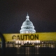 US capitol at night with caution tape