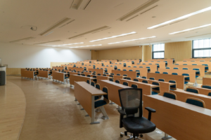 Stock image of an empty lecture hall.