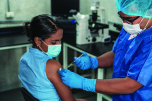 Stock image of woman receiving vaccine